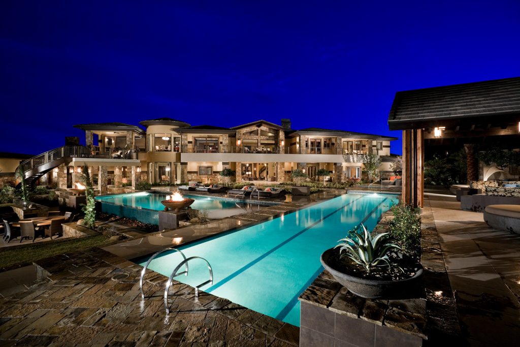 Resort-style residential pool and patio at dusk